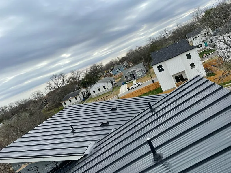 Standing seam metal roof panels with vents for Skylight Repair in Avon